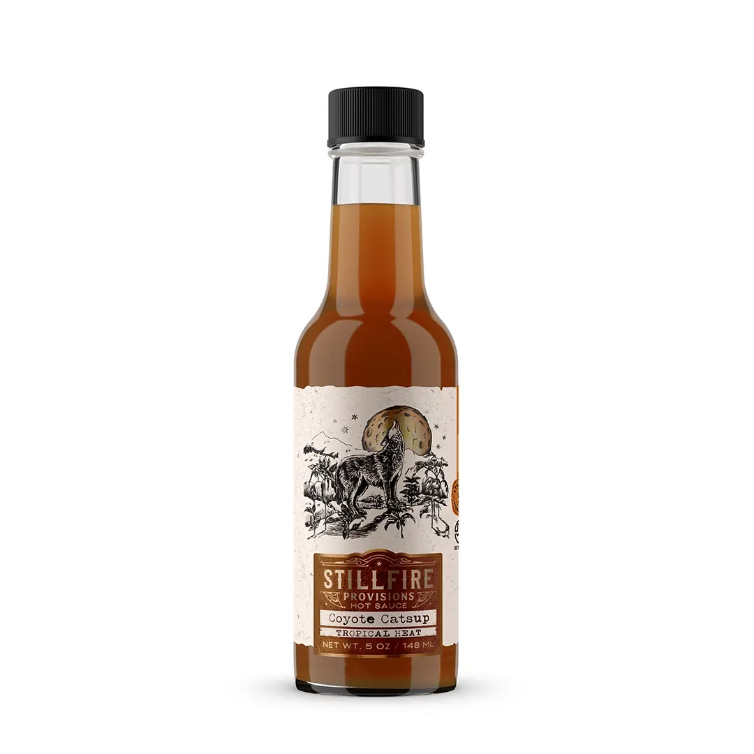 Bottle of Stillfire Provisions Coyote Catsup on a white background