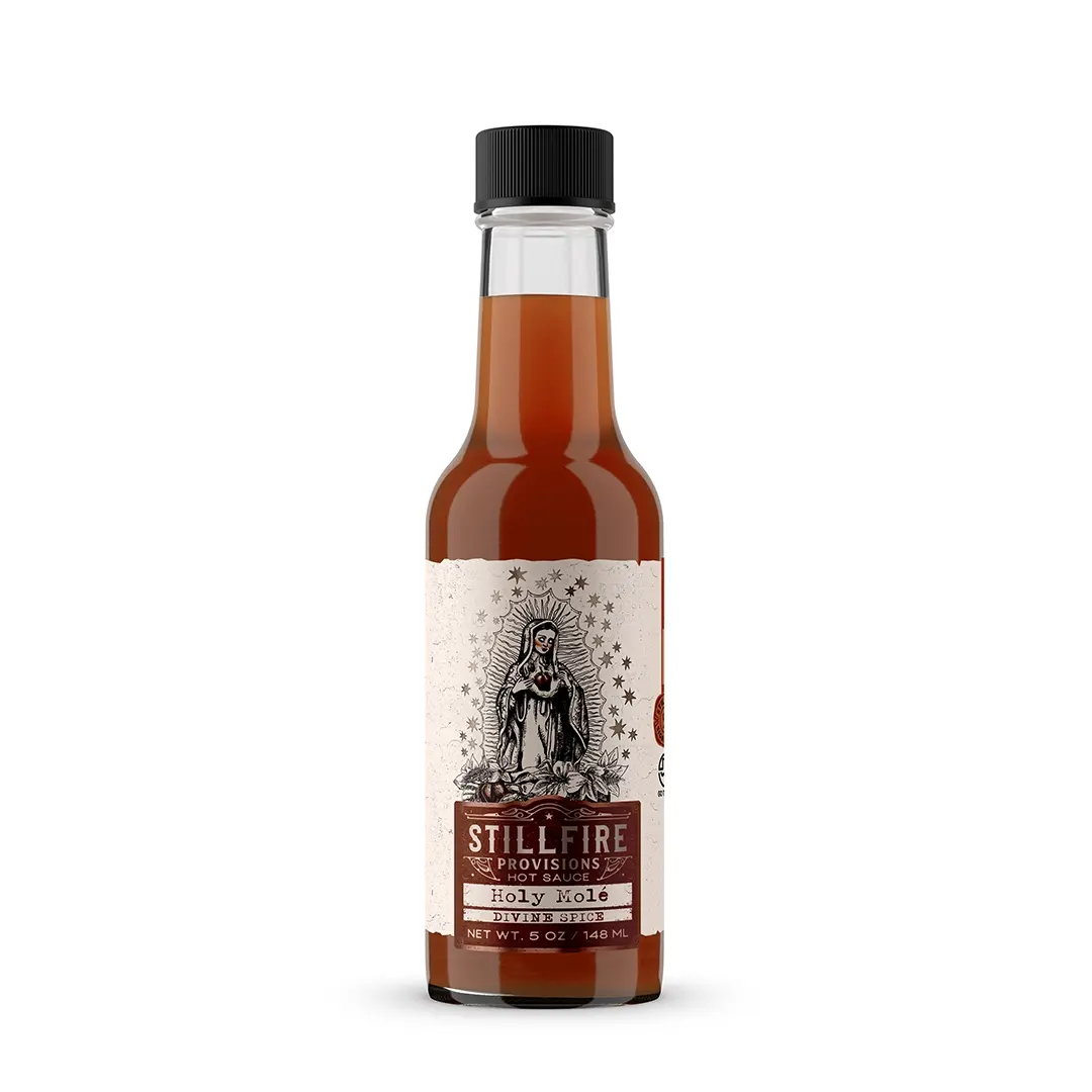 Bottle of Stillfire Provisions Holy Mole sauce on a white background