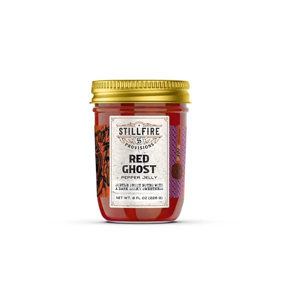 Jar of Stillfire Provisions Red Ghost Pepper Jelly on a white background