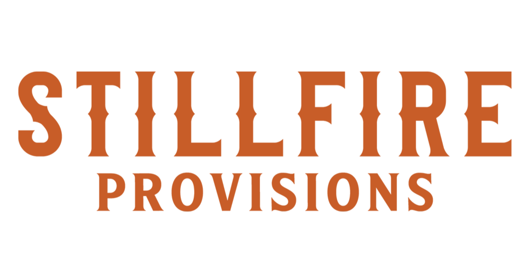 Logo of Stillfire Provisions with orange text on a white background