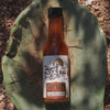 Coyote Catsup hot sauce, shown on a cactus-themed background.