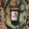 Aji Jabito Pepper Jelly in a jar, shown on a cactus-themed background.