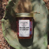 Brazilian Starfish Pepper Jelly in a jar, shown on a cactus-themed background.